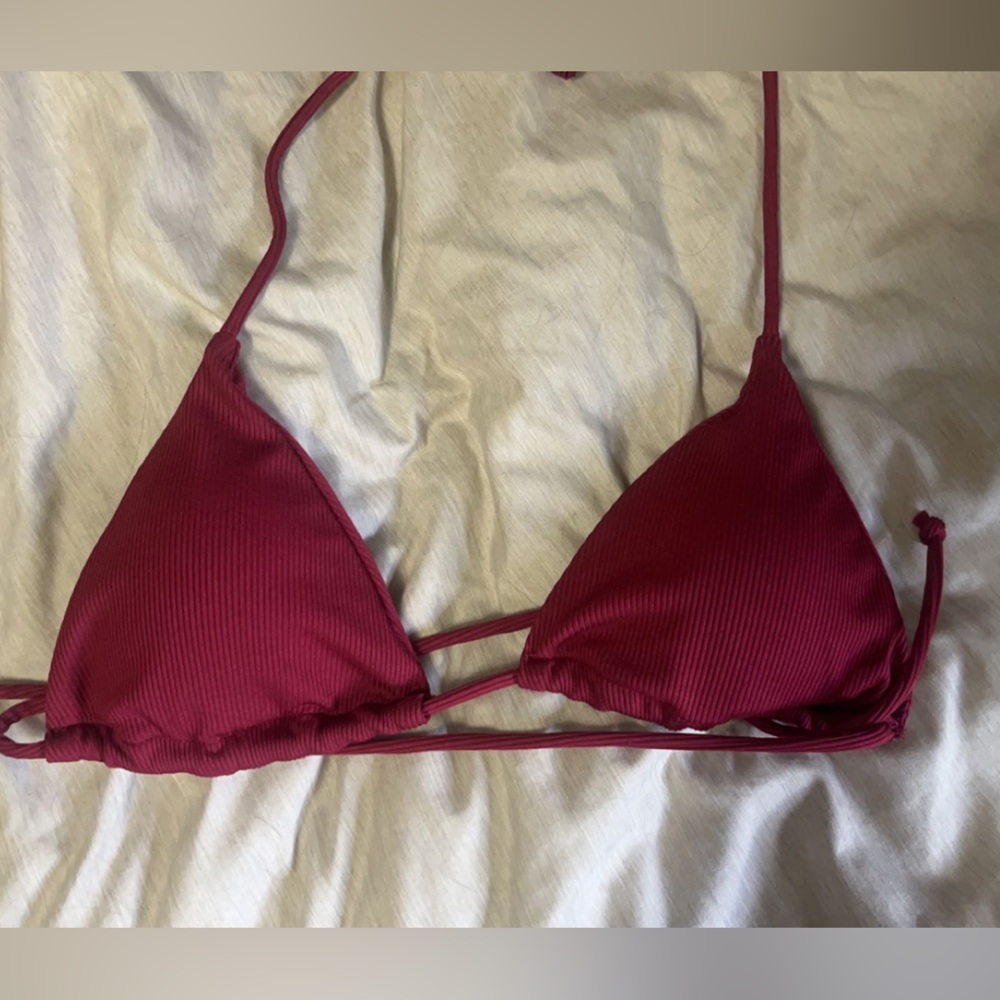 Maroon colored swimsuit top, size small